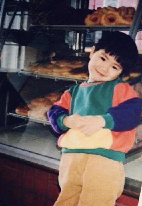 Four-year-old me at Best Donuts — with one of my signature bowl cuts (Credit: Yin Y Chen)